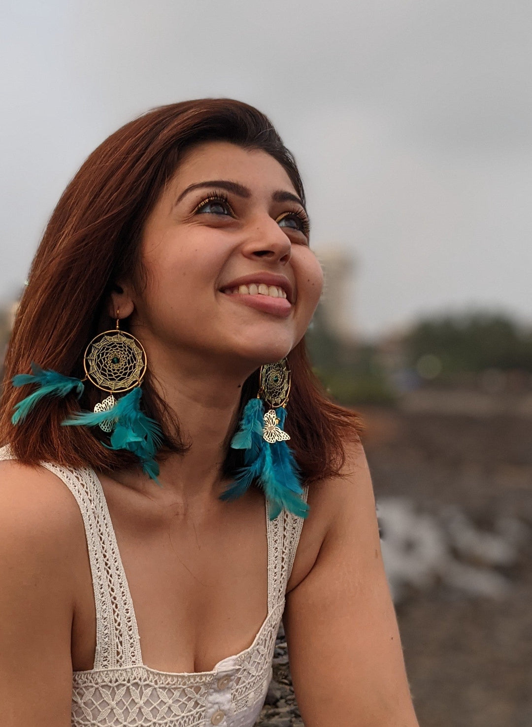 Dreamcatcher teal earring